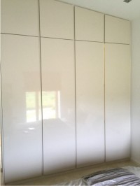 A gloss finish fitted wardrobe is both functional and stylish - Barrett Kitchens, Donegal
