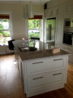 Hand painted in frame kitchen with central unit and granite tops,  designed and fitted by Barrett Kitchens, Co. Donegal, Ireland