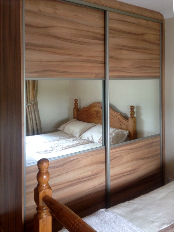 Wood Sliding robe with mirror - bedroom units designed and fitted by Barrett Kitchens, Donegal, Ireland