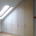 Large hand painted white fitted wardrobe unit in an attic conversion - Barrett Kitchens, Donegal, Ireland