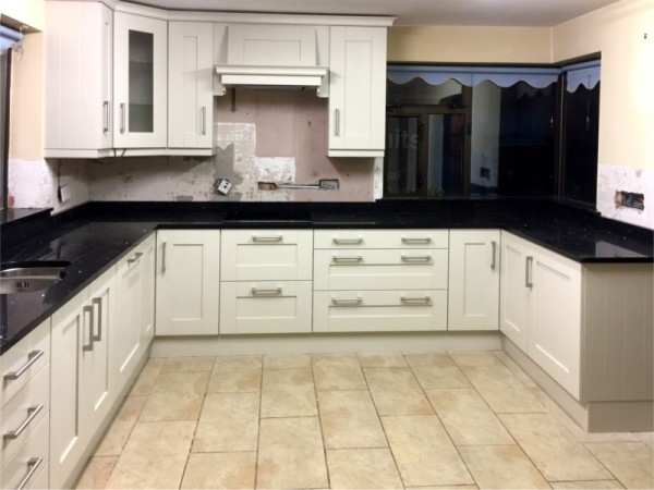 Hand-painted mussel kitchen, combined with dark worktops -  designed and fitted by Barrett Kitchens, Donegal, Ireland