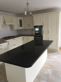 Albany Ivory painted kitchen with walnut worktop on main kitchen and Quartz on island